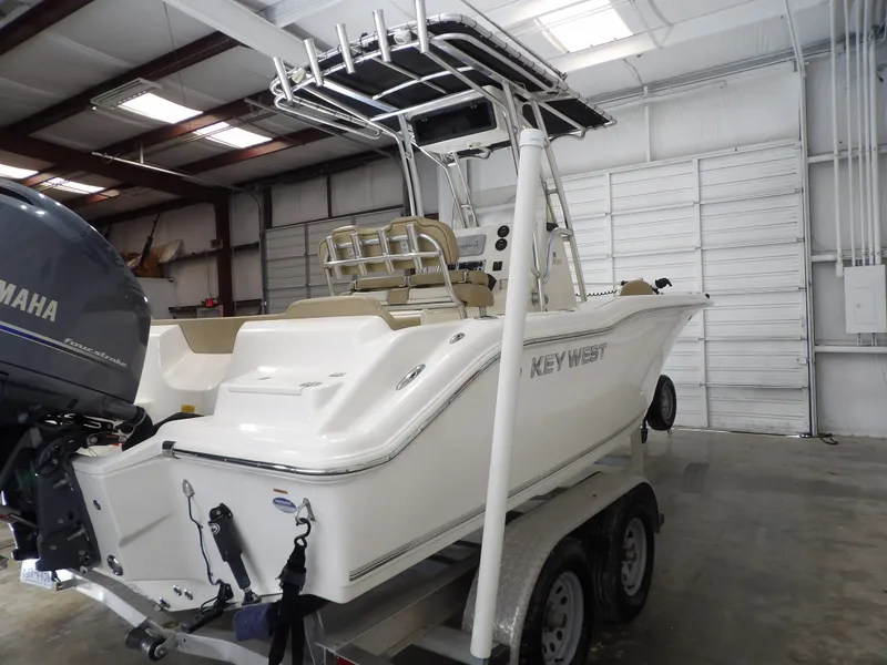 Slide: The Image of 2016 Key West 219 FS boat in warehouse on trailer. - 5