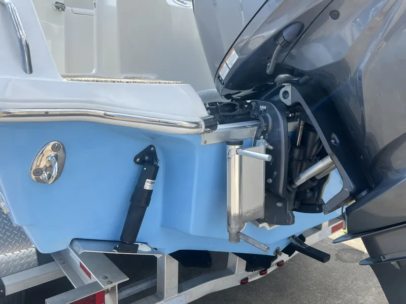 Slide: The Image of Rear view of a 2021 Tidewater 292 CC Adventure boat on trailer. - 10
