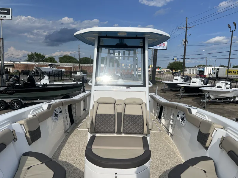 Slide: The Image of 2021 Tidewater 292 CC Adventure boat with outdoor seating area. - 24