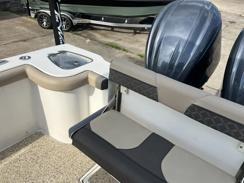 Slide: The Image of Interior of a 2021 Tidewater 292 CC Adventure boat with seating area. - 47