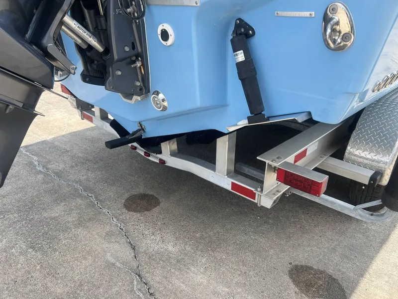 Slide: The Image of Rear view of a 2021 Tidewater 292 CC Adventure boat on trailer. - 15