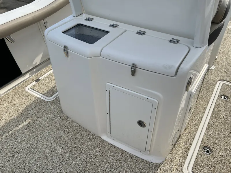 Slide: The Image of Tidewater 292 CC Adventure 2021, boat cabin with storage compartment. - 43