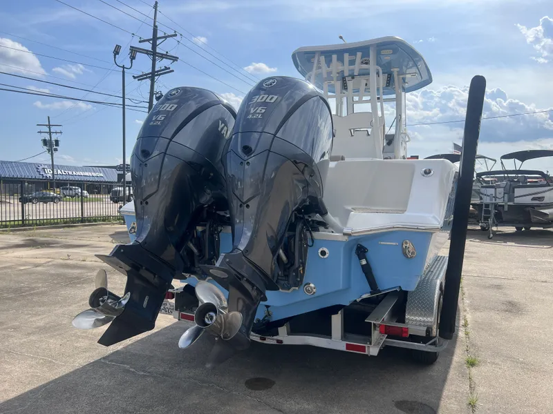 Slide: The Image of 2021 Tidewater 292 CC Adventure with twin Yamaha engines on trailer. - 9
