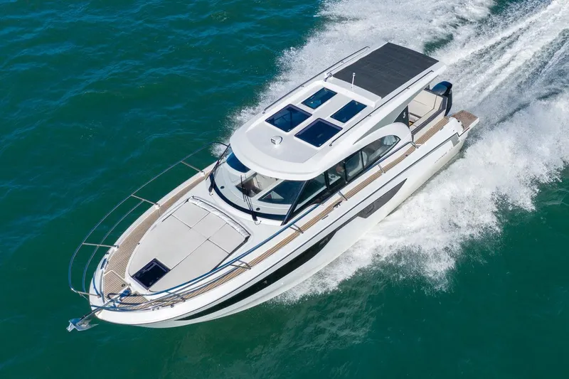 The Image of Manufacturer Provided Image: 2026 Beneteau Antares 11 Coupe cruising on open water, showcasing sleek design and performance. - 0