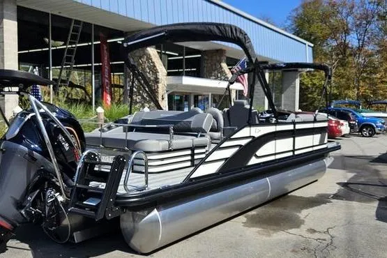 The Image of 2026 Bennington 24 L Swingback pontoon boat with sleek design, parked outdoors. - 0