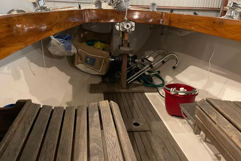 Slide: The Image of Interior of a 1965 Chris Craft Sheilds sailboat with wooden seating and nautical equipment. - 8