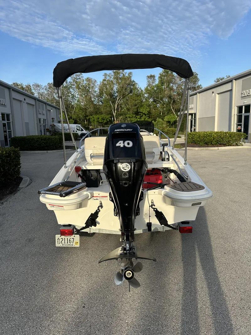 The Image of Rear view of a 2025 Boston Whaler 130 Super Sport boat with Mercury 40 engine. - 0