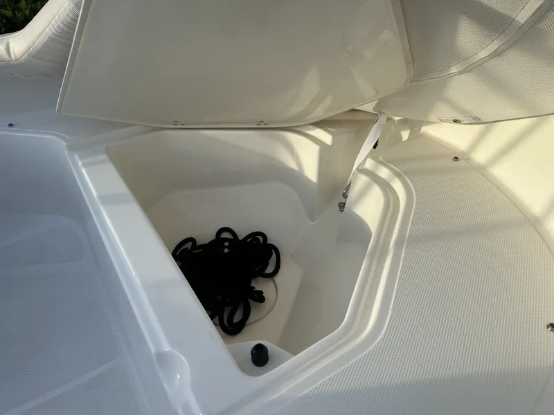 Slide: The Image of Storage compartment in 2025 Boston Whaler 130 Super Sport boat. - 13
