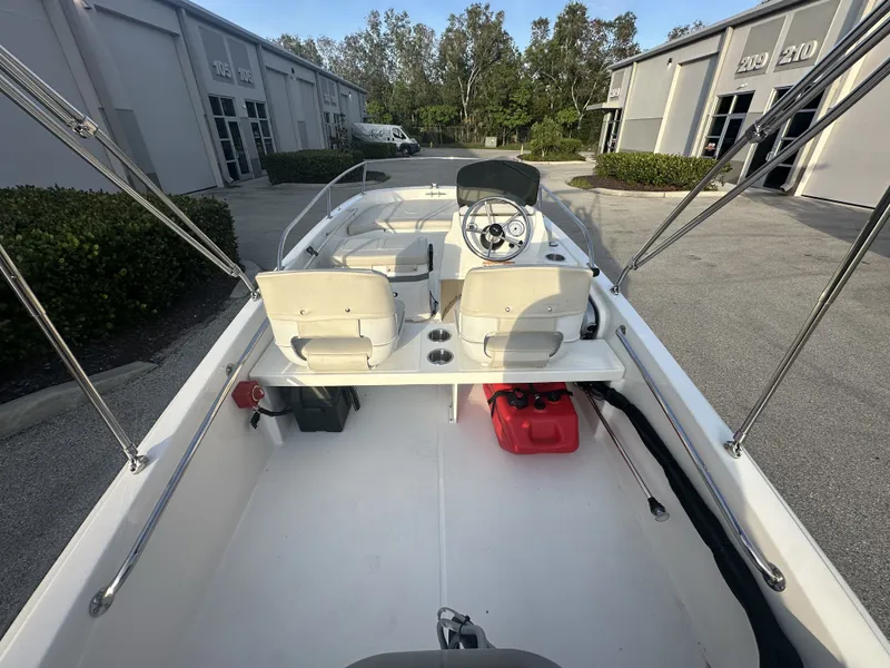 Slide: The Image of Interior view of a 2025 Boston Whaler 130 Super Sport boat. - 5