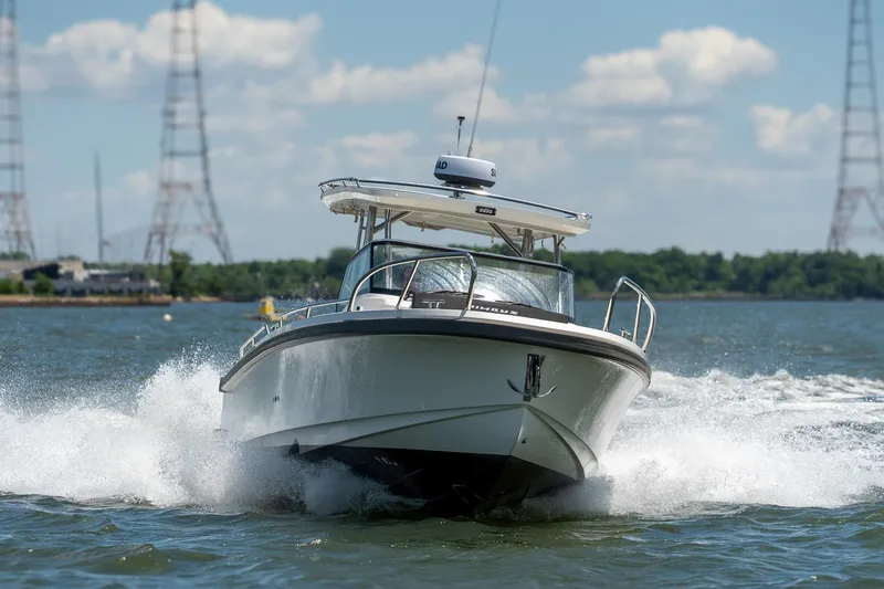 Slide: The Image of Nimbus Tender 9 boat 2023 cruising on water at high speed. - 5