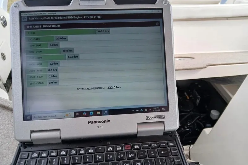 Slide: The Image of Panasonic Toughbook displaying engine hours for 2006 Rinker 300 Express Cruiser. - 22