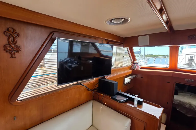 Slide: The Image of Interior of 1991 Marine Trader Trawler with TV and wooden decor. - 18