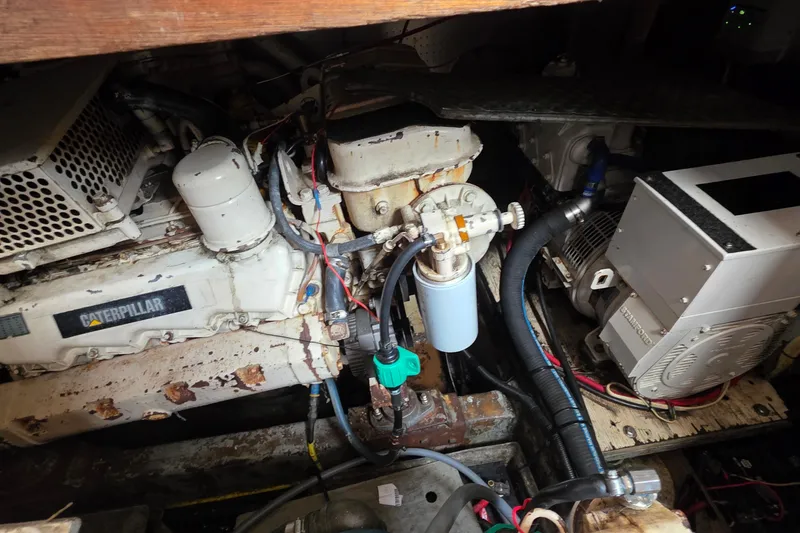 Slide: The Image of Engine room of a 1991 Marine Trader Trawler with Caterpillar components. - 29
