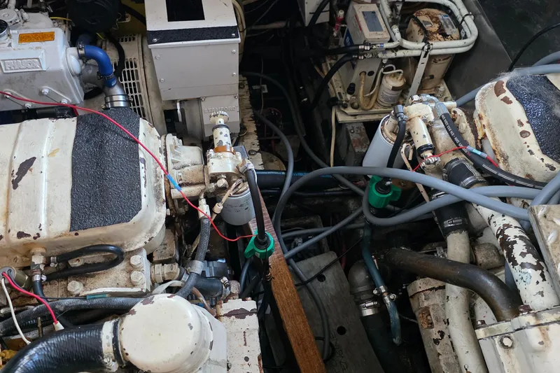 Slide: The Image of Engine room of a 1991 Marine Trader Trawler with visible machinery and components. - 39
