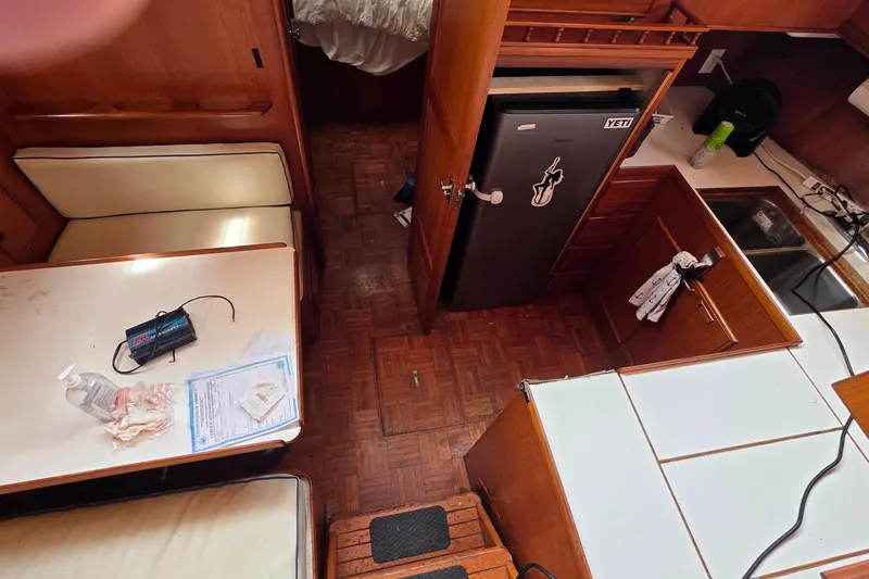 Slide: The Image of Interior of a 1991 Marine Trader Trawler with kitchen and dining area. - 6