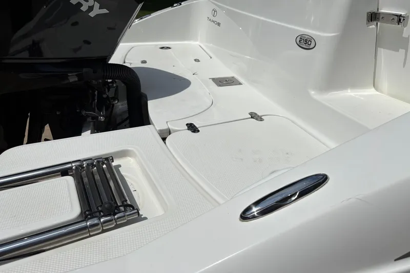 Slide: The Image of 2020 Tahoe 2150 CC boat deck with Mercury engine and foldable ladder. - 10