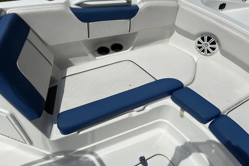 Slide: The Image of Interior seating of 2020 Tahoe 2150 CC boat with blue and white upholstery. - 14
