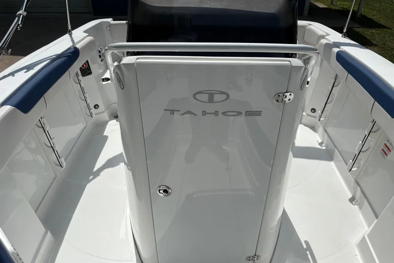 Slide: The Image of 2020 Tahoe 2150 CC boat interior with sleek white design and blue accents. - 15