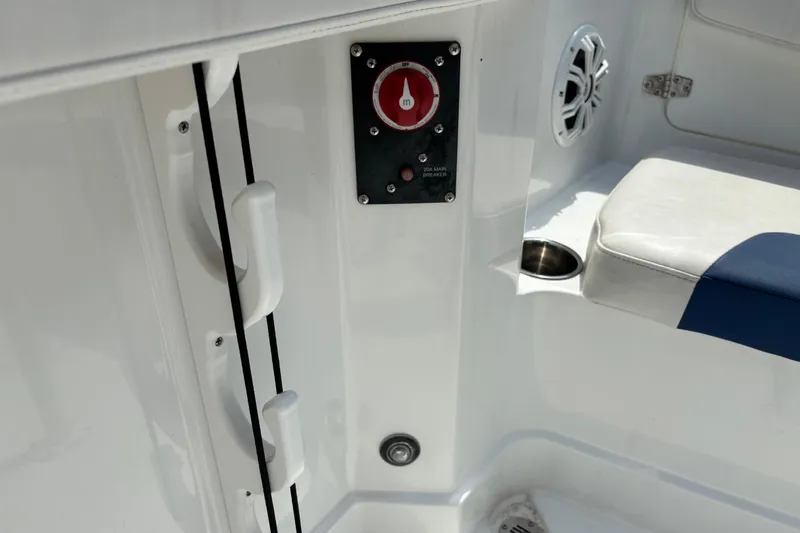 Slide: The Image of 2020 Tahoe 2150 CC boat interior with control panel and seating area. - 18