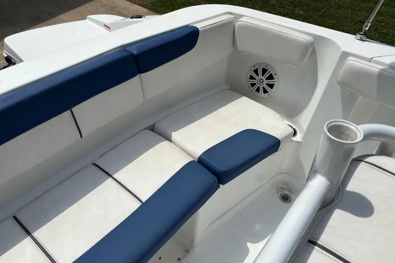 Slide: The Image of Interior seating of 2020 Tahoe 2150 CC boat with blue and white cushions. - 20