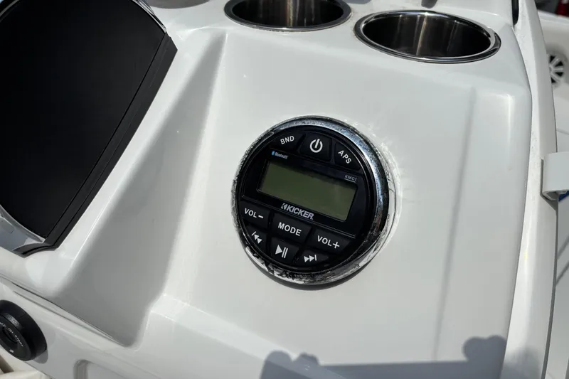 Slide: The Image of Control panel of 2020 Tahoe 2150 CC boat featuring Kicker audio system. - 21