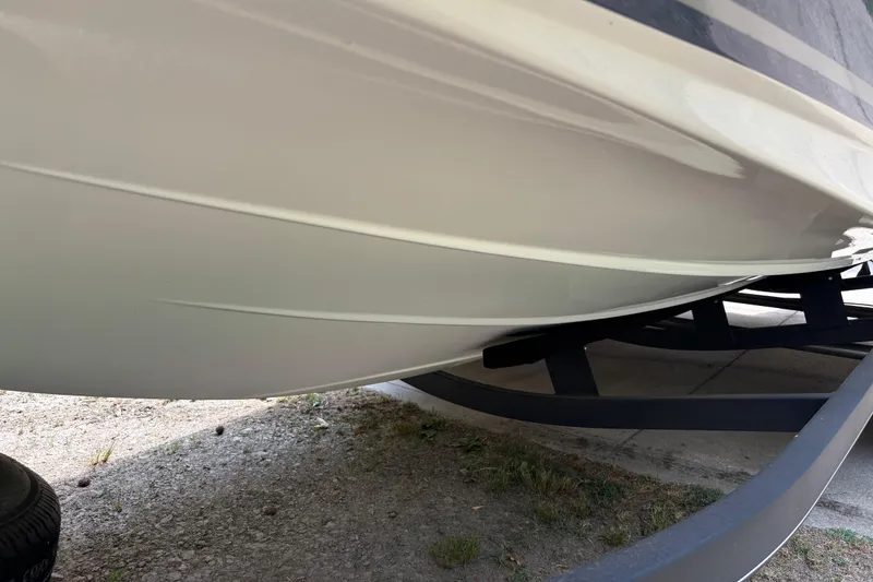 Slide: The Image of 2020 Tahoe 2150 CC boat hull on trailer, showcasing sleek design and smooth finish. - 25