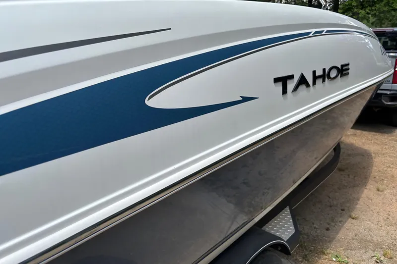 Slide: The Image of 2020 Tahoe 2150 CC boat with sleek blue and white design. - 28