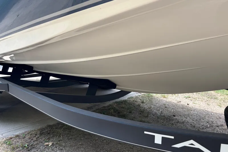 Slide: The Image of 2020 Tahoe 2150 CC boat hull on trailer, showcasing sleek design and sturdy construction. - 30
