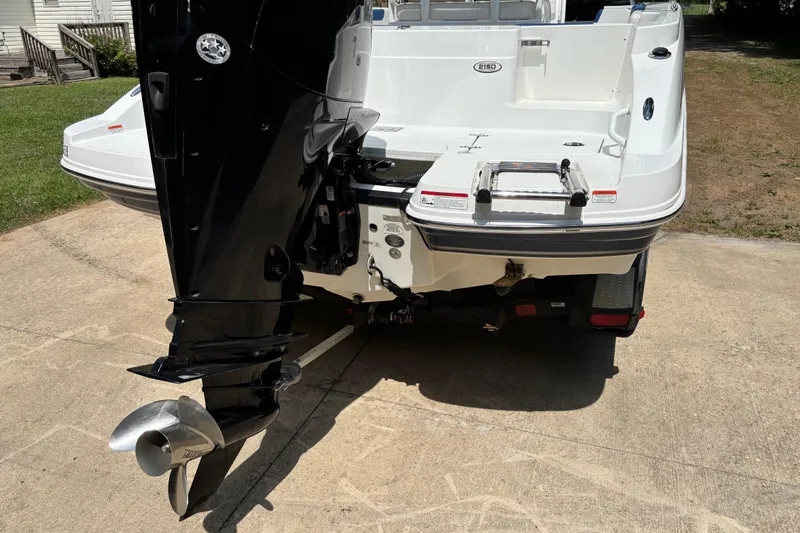 Slide: The Image of 2020 Tahoe 2150 CC boat rear view with outboard motor and swim platform. - 5