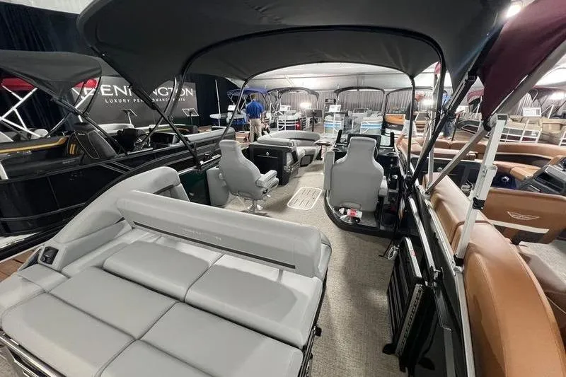 Slide: The Image of 2026 Bennington 22 M Swingback pontoon boat interior with luxurious seating and canopy. - 10