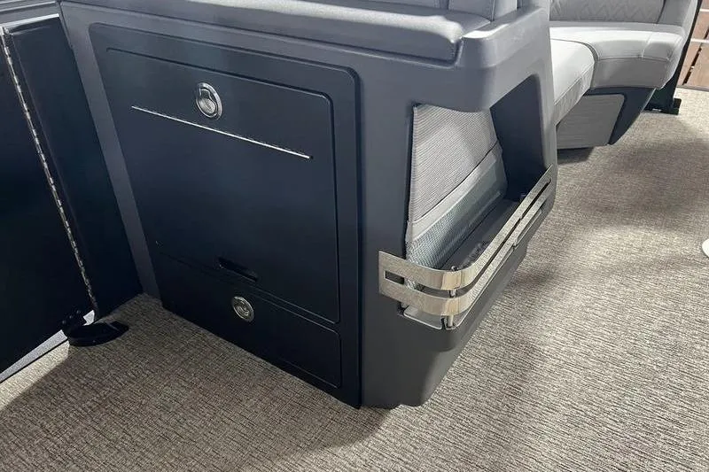 Slide: The Image of Interior of 2026 Bennington 22 M Swingback with sleek storage compartment and seating. - 3