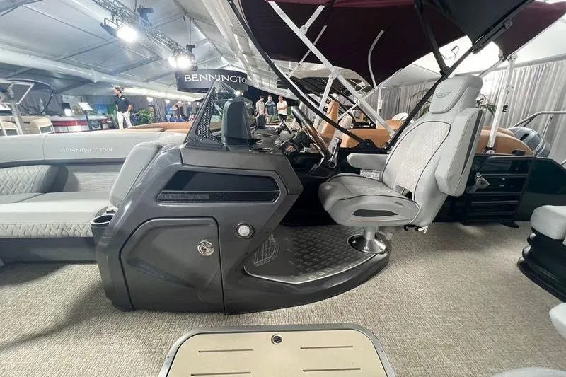Slide: The Image of 2026 Bennington 22 M Swingback boat interior with modern helm and seating. - 4