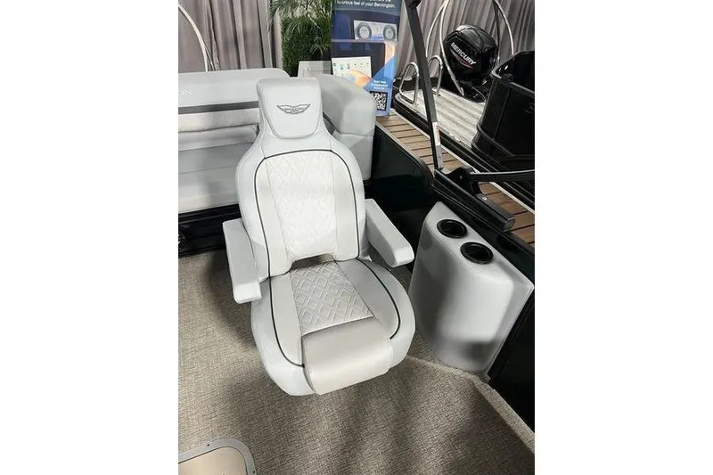 Slide: The Image of Luxury seating on 2026 Bennington 22 M Swingback boat, featuring elegant design and cup holders. - 5