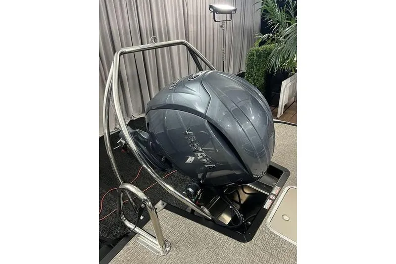 Slide: The Image of 2026 Bennington 22 M Swingback boat engine display in showroom setting. - 9