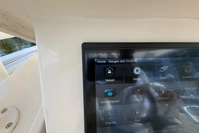 Slide: The Image of Touchscreen display on a 2016 Grady-White Canyon 336 boat showing gauges and controls. - 13