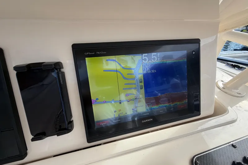 Slide: The Image of Garmin GPS display on 2016 Grady-White Canyon 336 boat dashboard. - 14