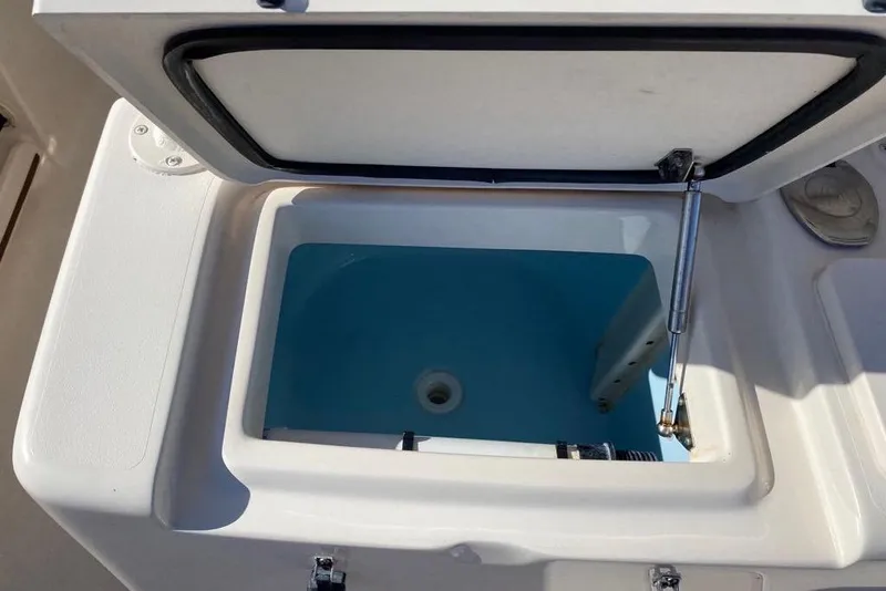 Slide: The Image of Open storage compartment on a 2016 Grady-White Canyon 336 boat. - 17