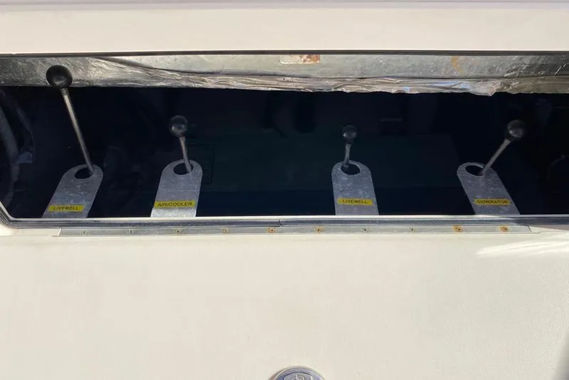 Slide: The Image of Control levers on a 2016 Grady-White Canyon 336 boat dashboard. - 18