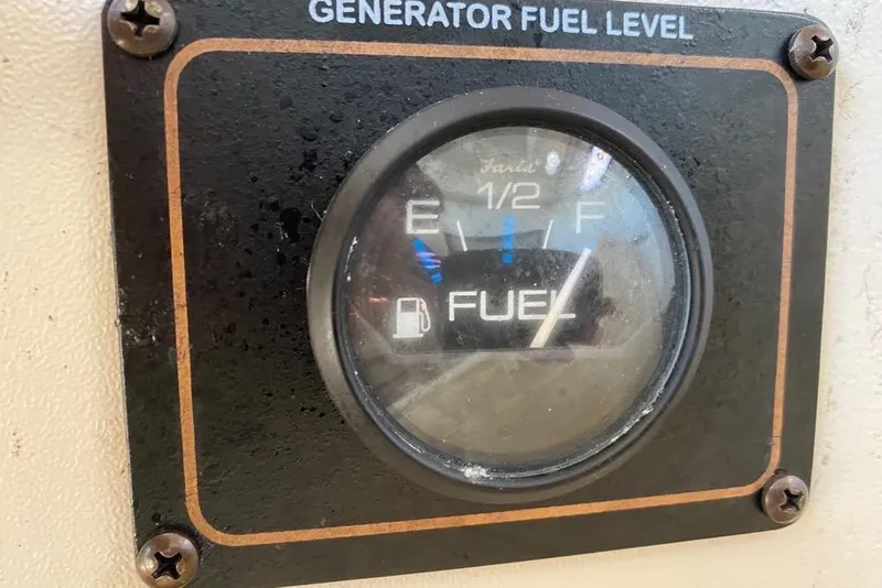 Slide: The Image of Generator fuel gauge on a 2016 Grady-White Canyon 336 boat, showing fuel level. - 19