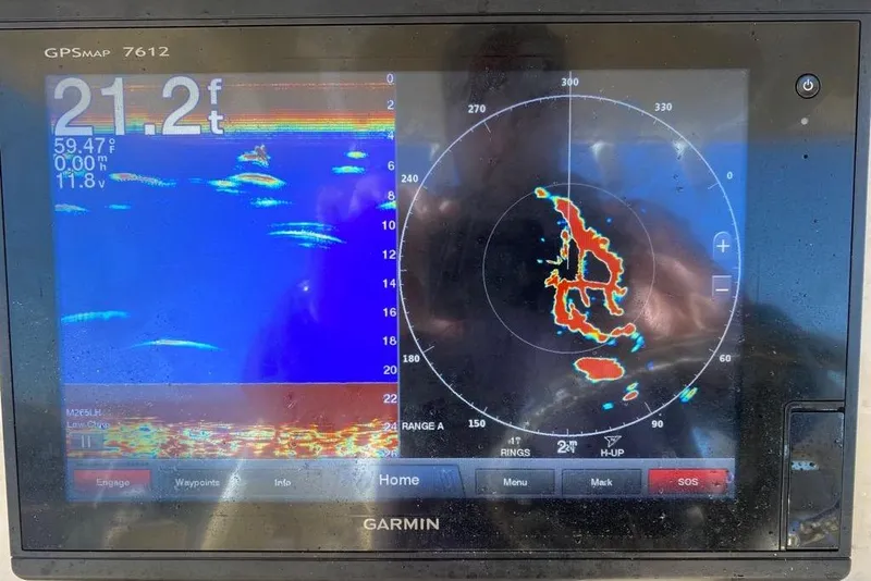 Slide: The Image of Garmin GPSMAP 7612 display on 2016 Grady-White Canyon 336 boat, showing sonar and radar data. - 20