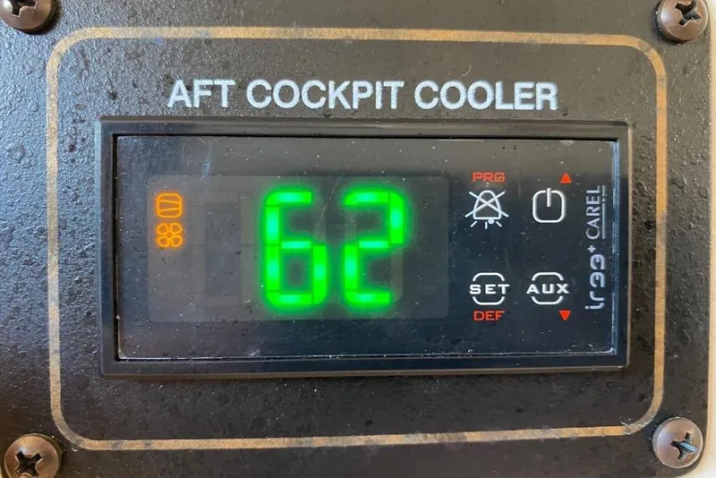 Slide: The Image of Aft cockpit cooler display showing 62 degrees on a 2016 Grady-White Canyon 336. - 25