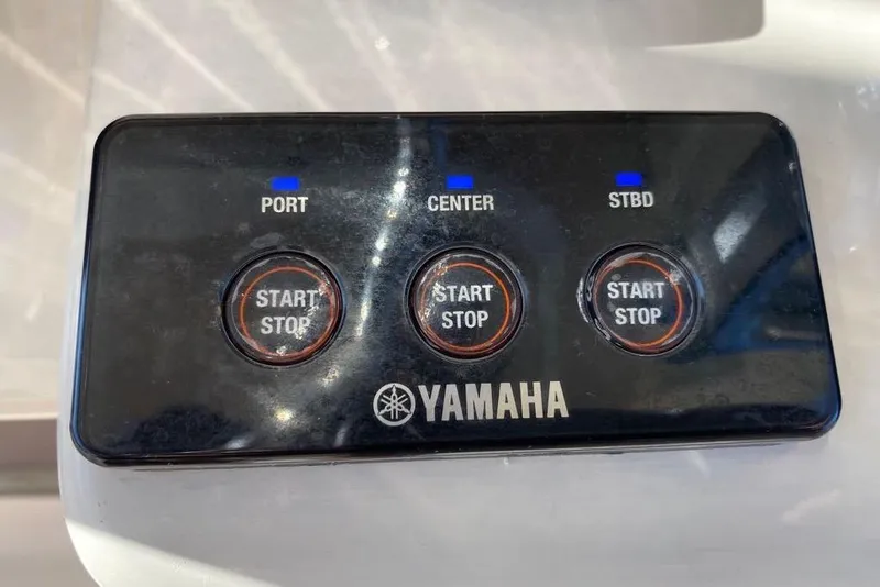 Slide: The Image of Yamaha engine control panel with start/stop buttons for Grady-White Canyon 336, 2016 model. - 26