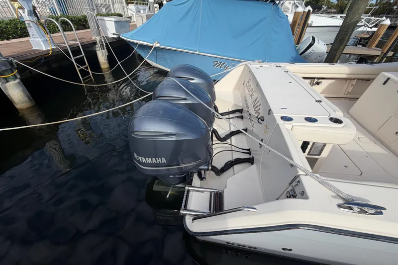 Slide: The Image of 2016 Grady-White Canyon 336 boat with Yamaha outboard engines docked at marina. - 3