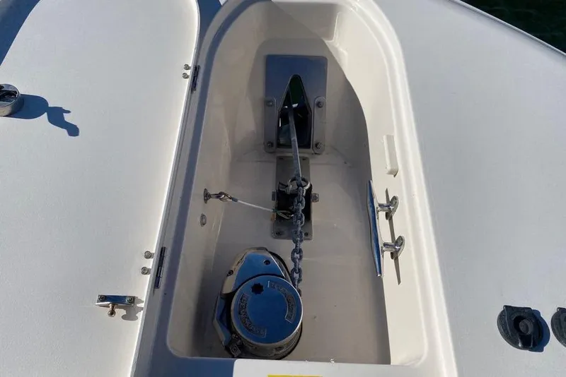 Slide: The Image of Anchor compartment of 2016 Grady-White Canyon 336 boat, featuring chain and winch. - 37