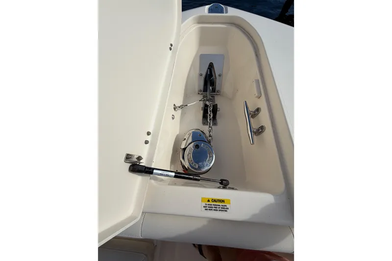 Slide: The Image of Anchor compartment of 2016 Grady-White Canyon 336 boat with chain and winch. - 9