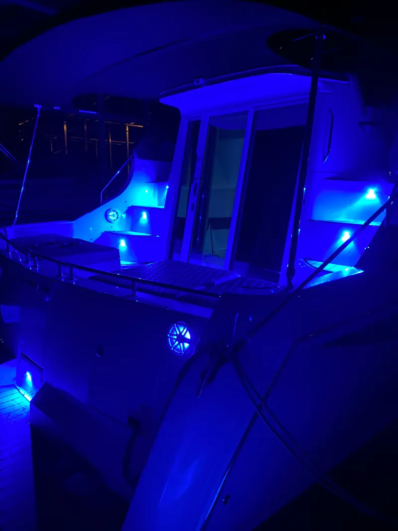 Slide: The Image of Carver 36 Mariner 2012 with blue LED lighting at night. - 11