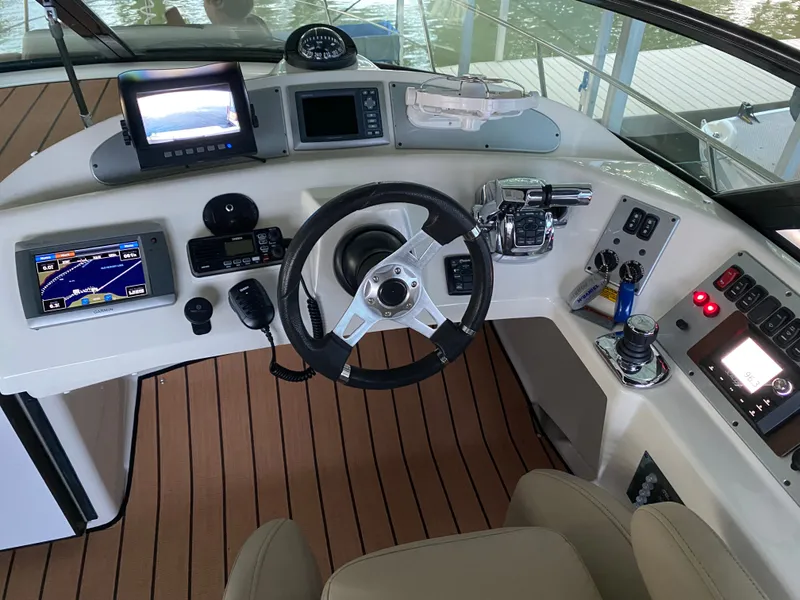 Slide: The Image of 2012 Carver 36 Mariner helm with navigation systems. - 14