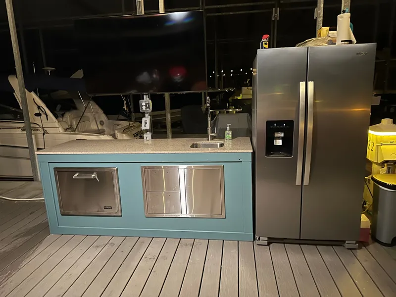 Slide: The Image of Modern outdoor kitchen with fridge and sink on a 2012 Carver 36 Mariner. - 21