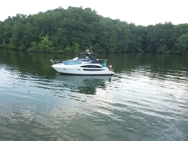 Slide: The Image of Carver 36 Mariner 2012 on calm lake near wooded shoreline. - 26