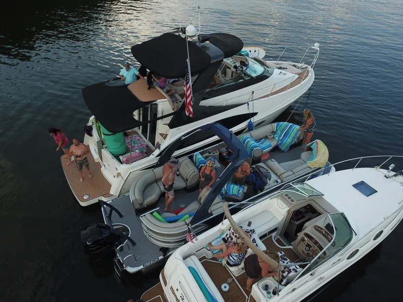 Slide: The Image of Carver 36 Mariner 2012 with people relaxing on the water. - 27